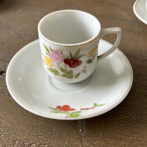 Tea cup with saucer has small make on plate made in Japan